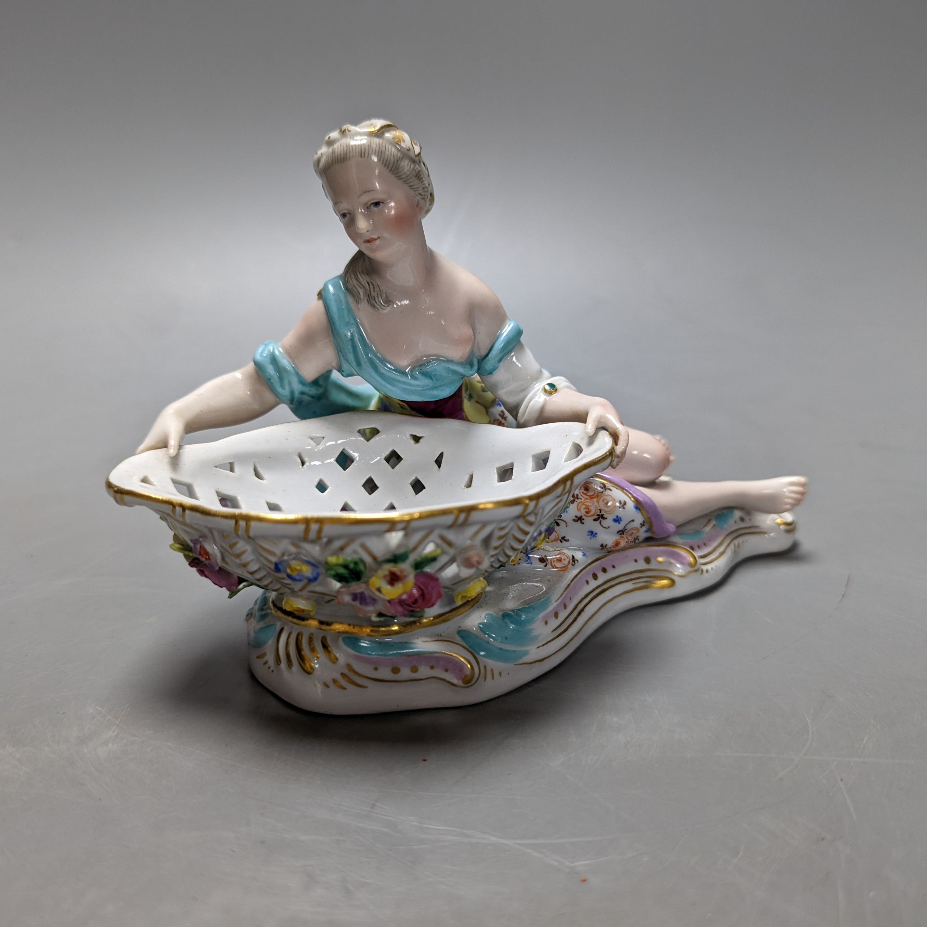 A 19th century Meissen figural basket, incised number to base ‘2875’ 17cm